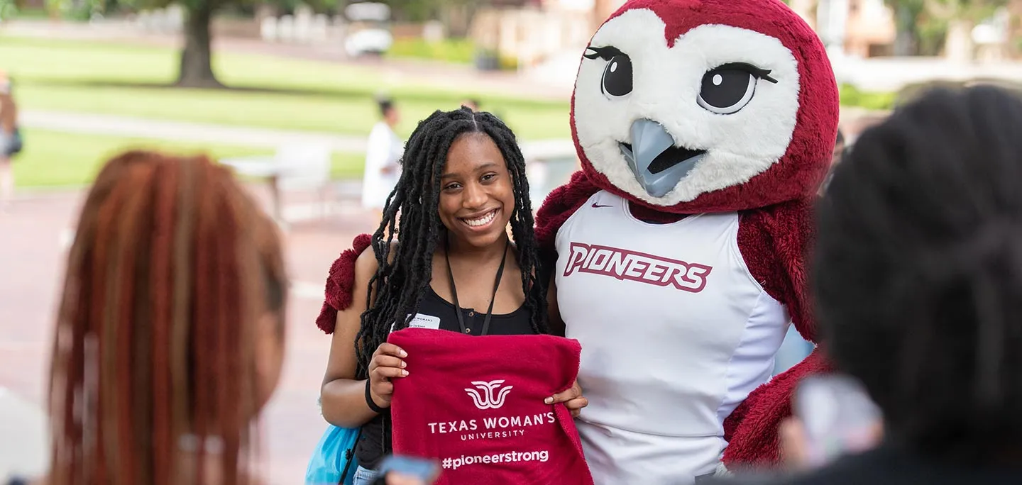 Smiling TWU student with Oakley