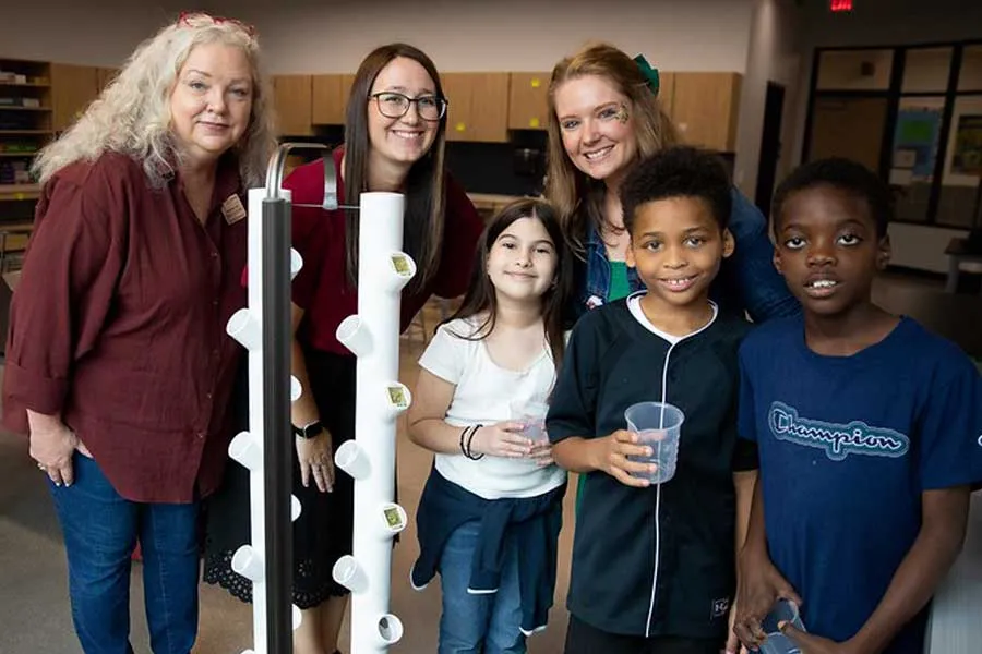 TWU faculty/staff celebrate new garden tower with Hill Elementary students and principal