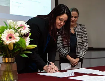 TWU English major Annah Stewart accepts her scholarship