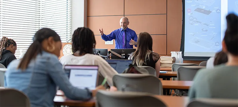 Dr. Rylander teaching class 