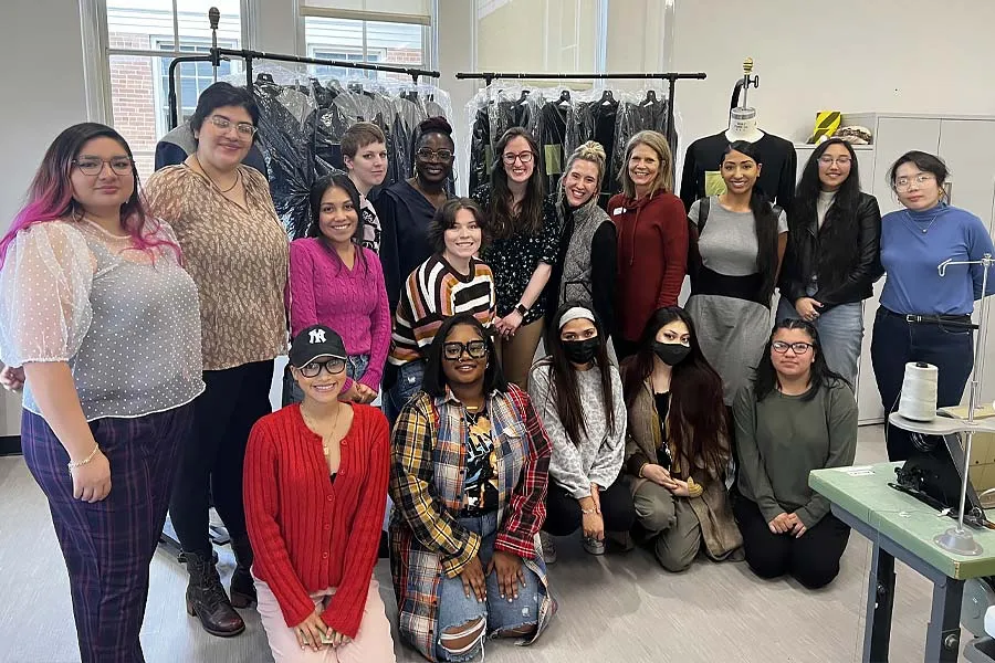 Mass Production Techniques students with clothing for homeless 
