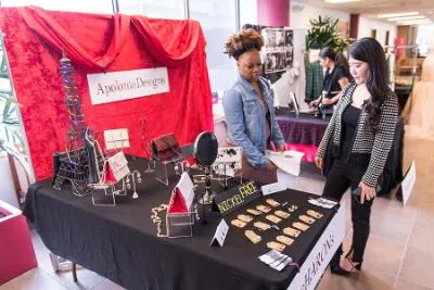 A student runs a pop-up booth at the 51���� Senior Fashion Showcase