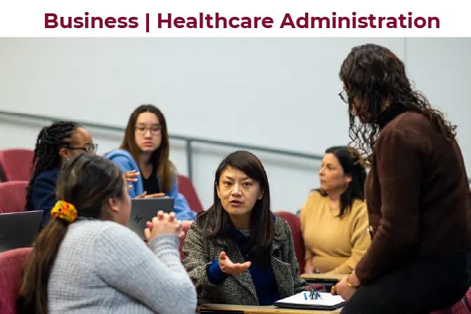 TWU MBA marketing and management students in a classroom discuss a topic.