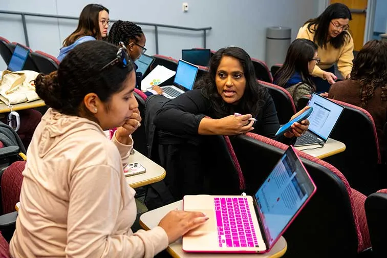 A TWU MBA classroom with students collaborating and working together.