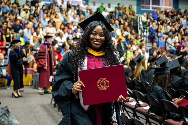 A TWU master's degree recipient at commencement.