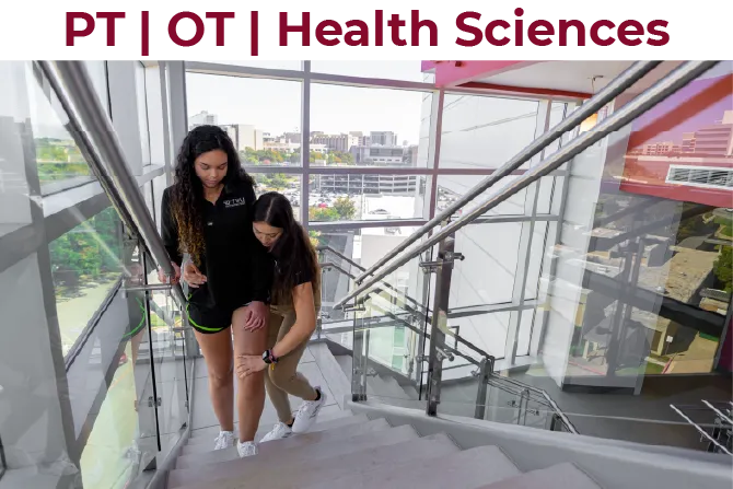 A TWU PT student assists another student going up the stairs in a PT demonstration on the Dallas campus.