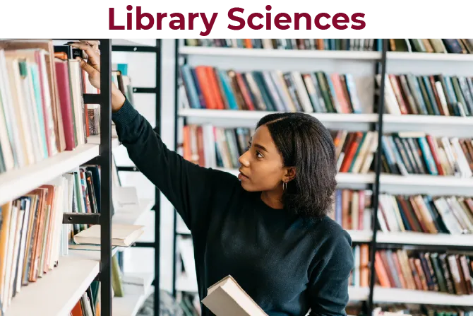 A woman puts books back on a shelf in a library setting.