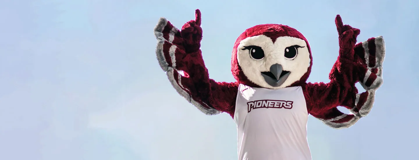 Oakley pointing up to the sky with a blue sky background.