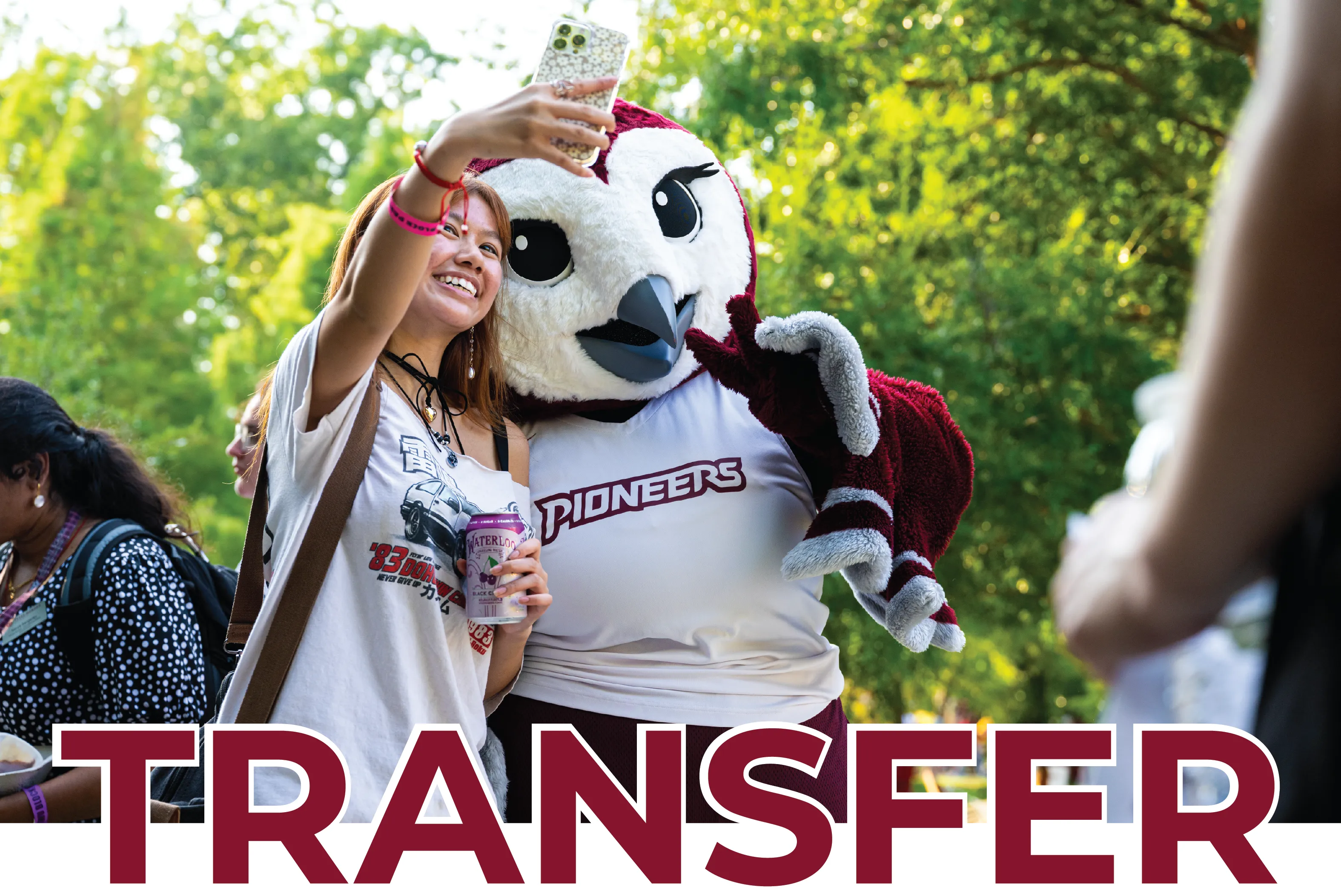 A student takes a selfie with Oakley with graphic text on the photo that says "Transfer".