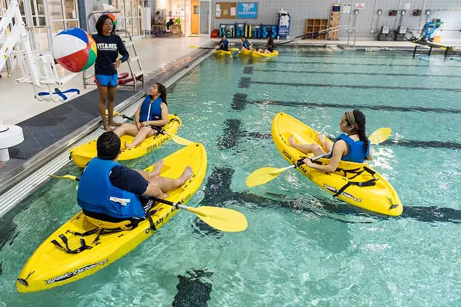 Students in Ikayaks at the ndoor Pool
