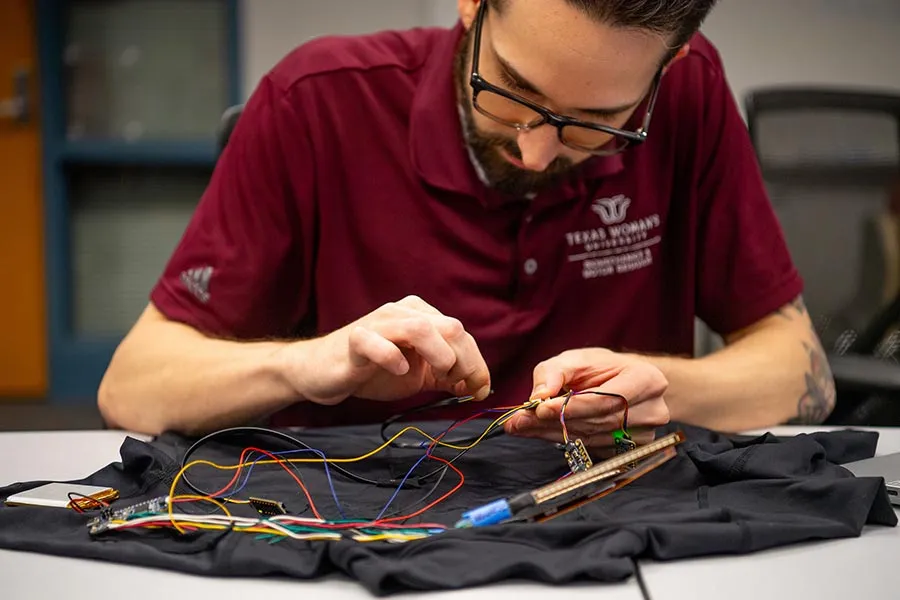 Hunter Alvis works on his device, which incorporates electrical engineering, biomechanics and physiology