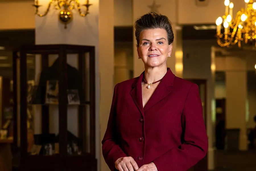 profile picture of Dean Catrine Tudor-Locke standing in the library