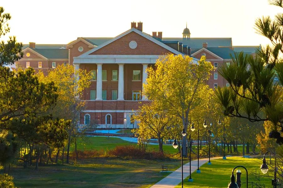 south side exterior of Health Sciences Center with fall foliage