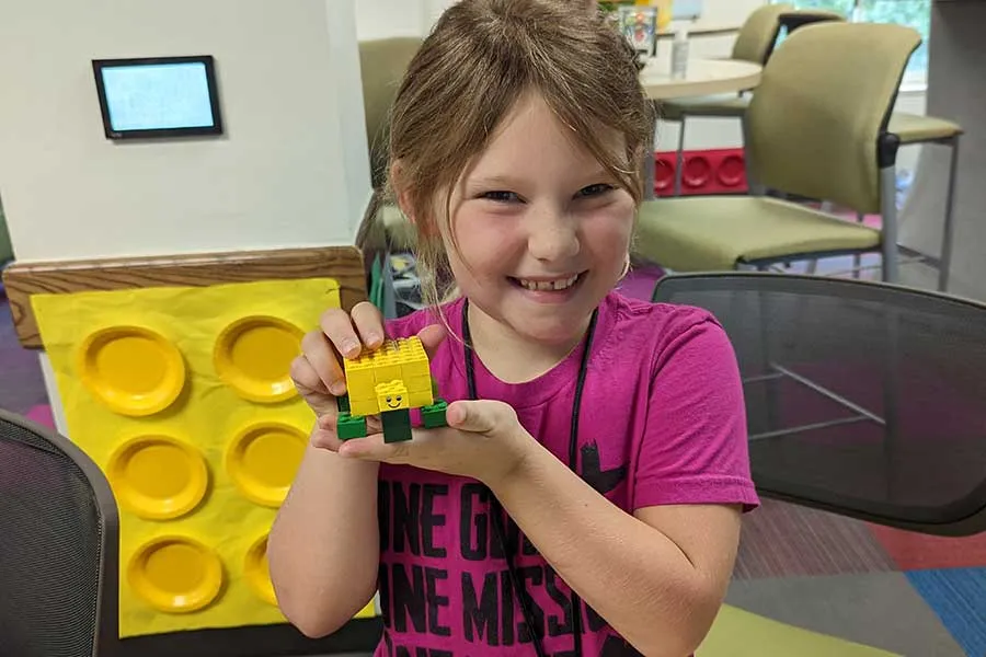 A camper showing off their creation.