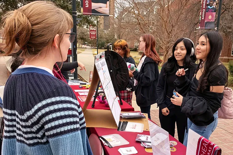 Students interacting with Health and Wellbeing