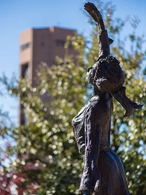 A close-up of the She Gave Us Wings statue on the TWU Denton campus