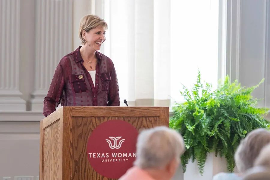 Chancellor Carine M. Feyten addresses the 2022 Homecoming attendees
