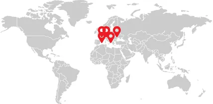 A world map with numerous red pins over Europe