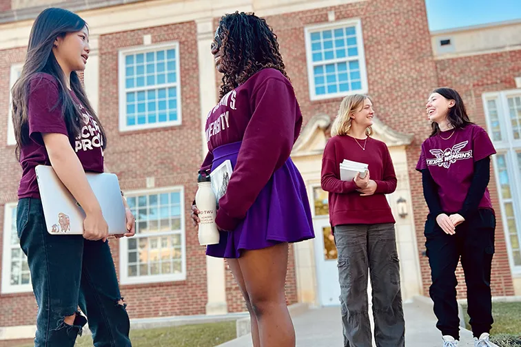 TWU Honors students standing and talking