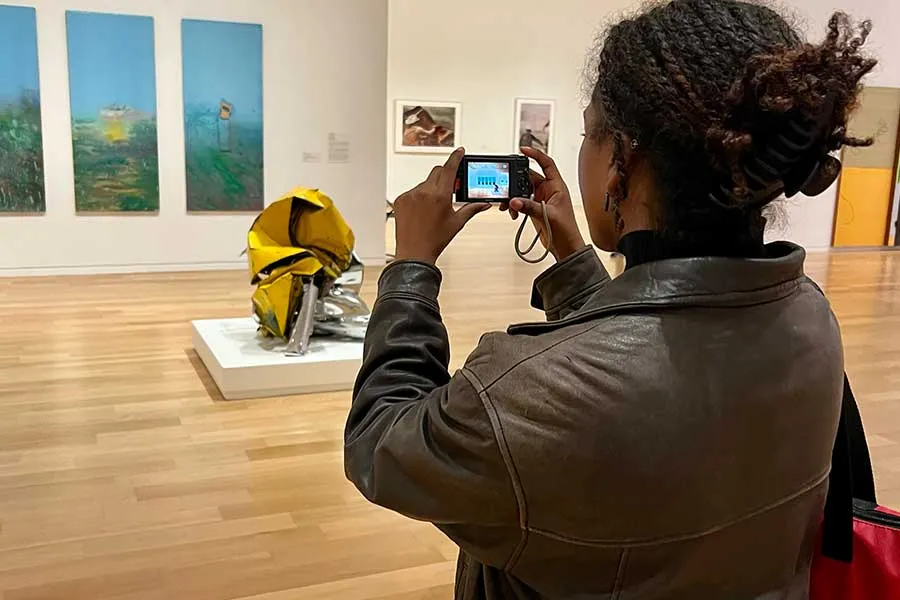 An Honors student takes a photo at the Fort Worth Modern