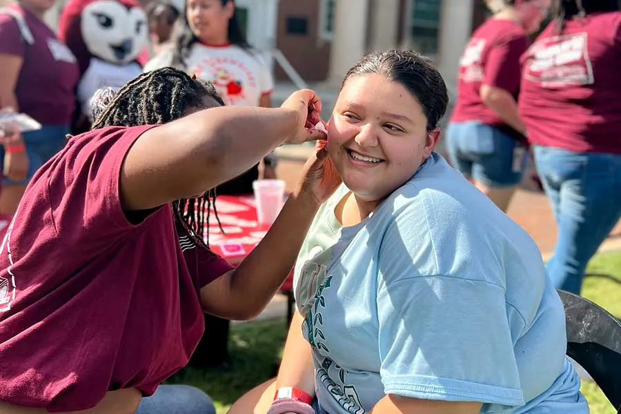 An Honors student getting a face painting