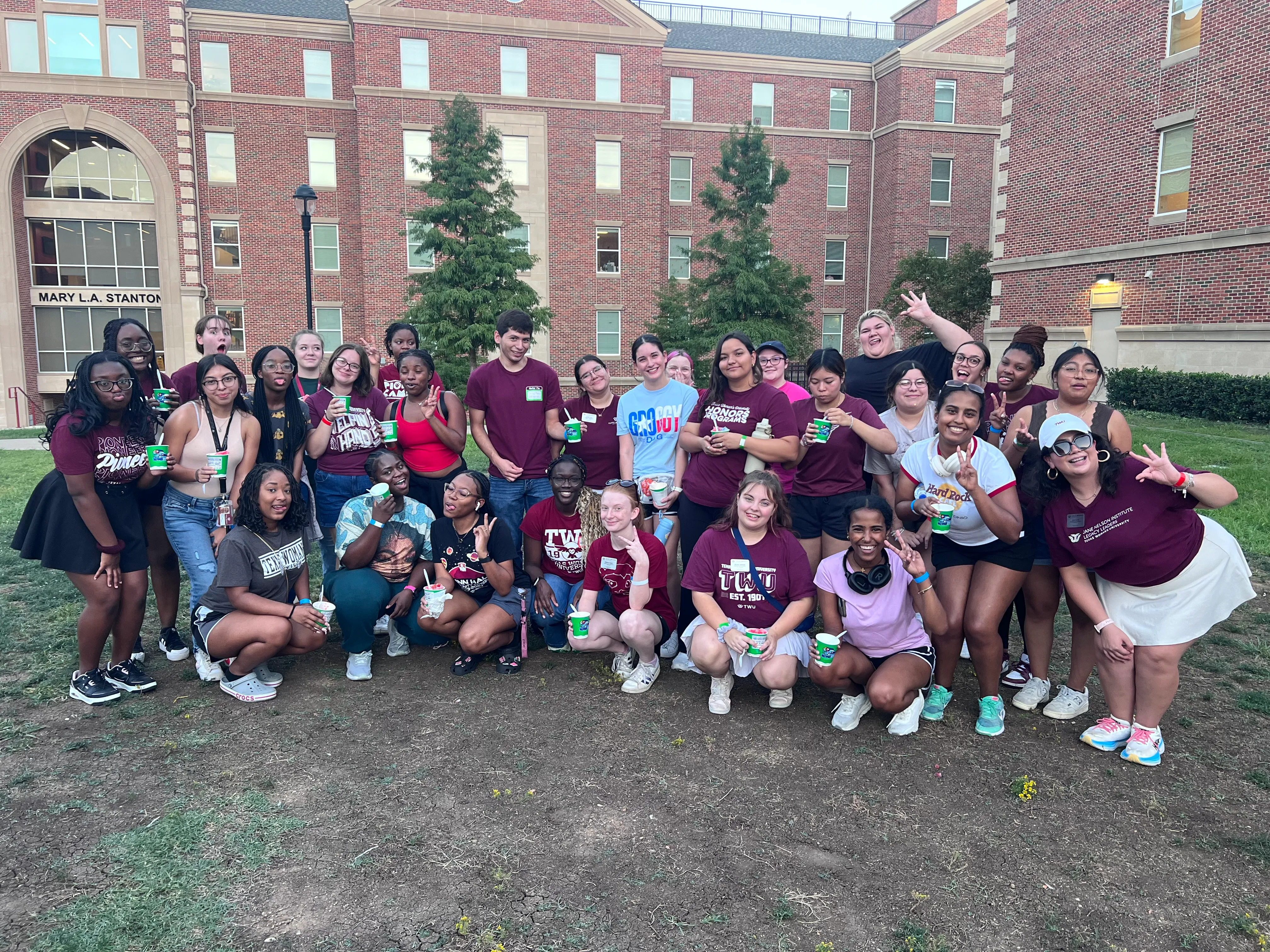 Group photo outside in Parliament Village courtyard