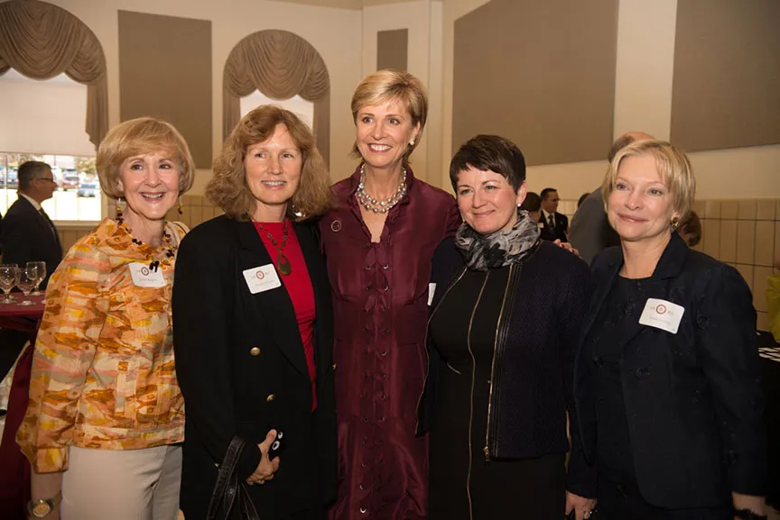 Chancellor Feyten poses with four other women