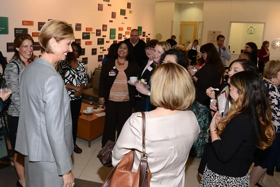 Chancellor Feyten chats with a group of women