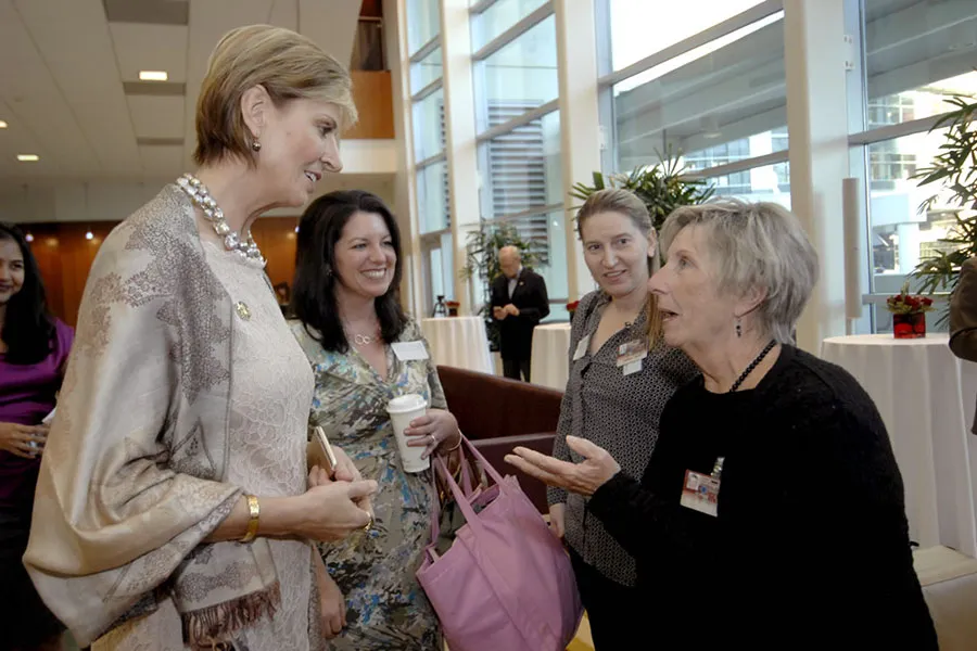 Chancellor Feyten speaks with reception guests