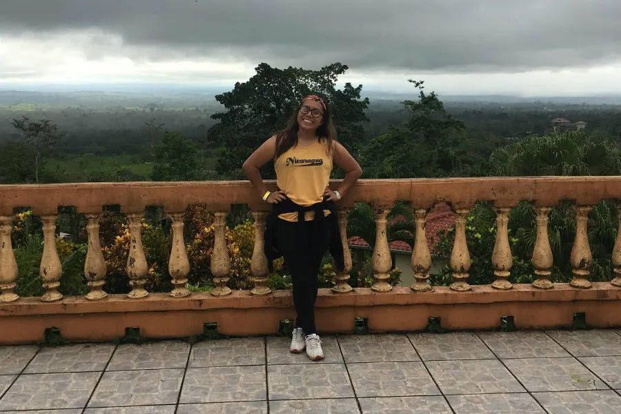 Guadalupe Resendiz smiling against the jungle backdrop of Costa Rica. 