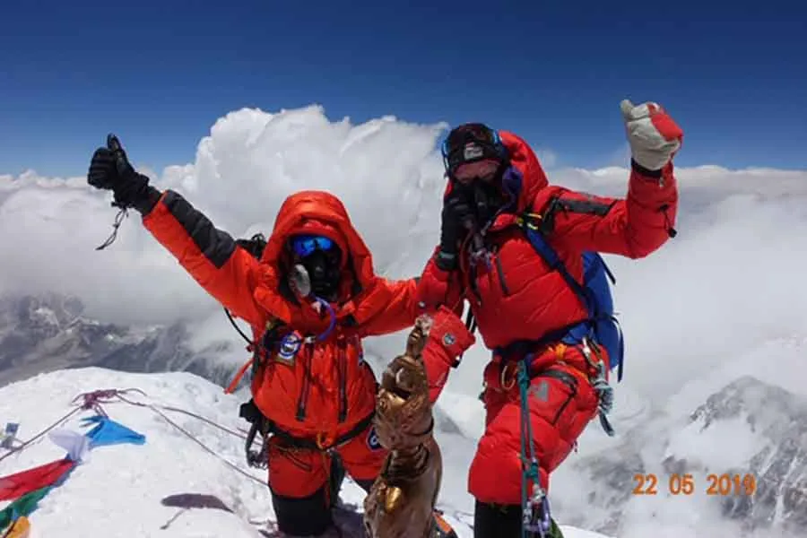 Roxanne Vogel at the top of Mt. Everest. Photo Credit to Lydia Bradey.