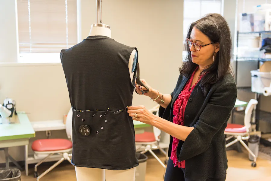 Fashion professor Sheri Dragoo works on NASA garment