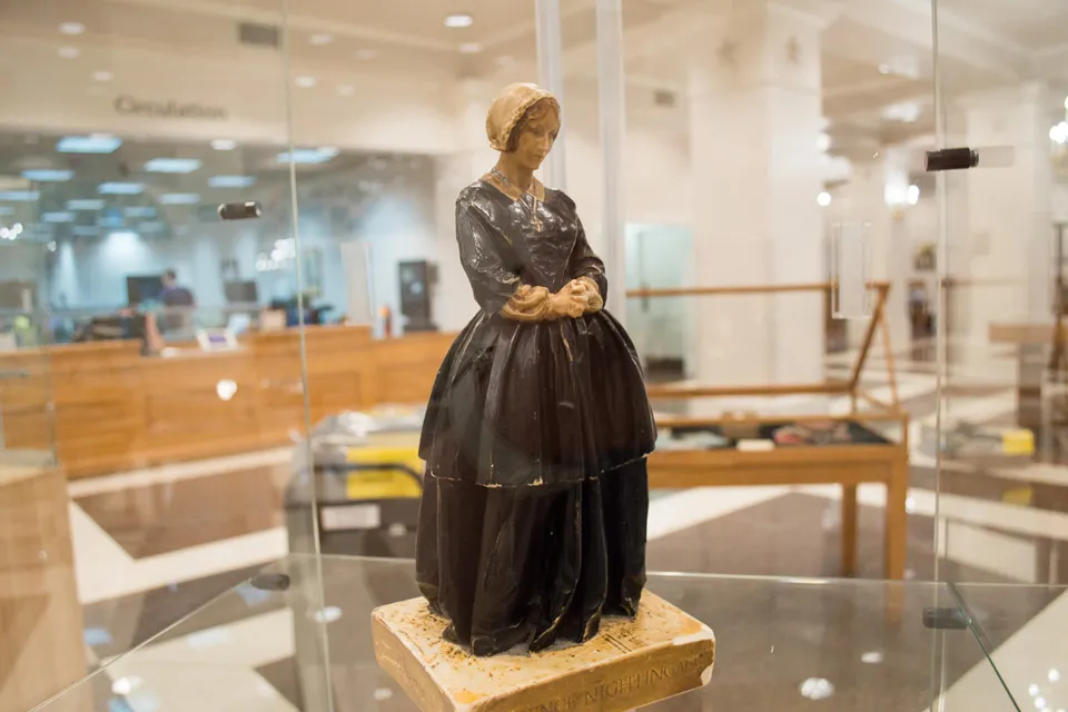 Florence Nightingale statue in a glass case.