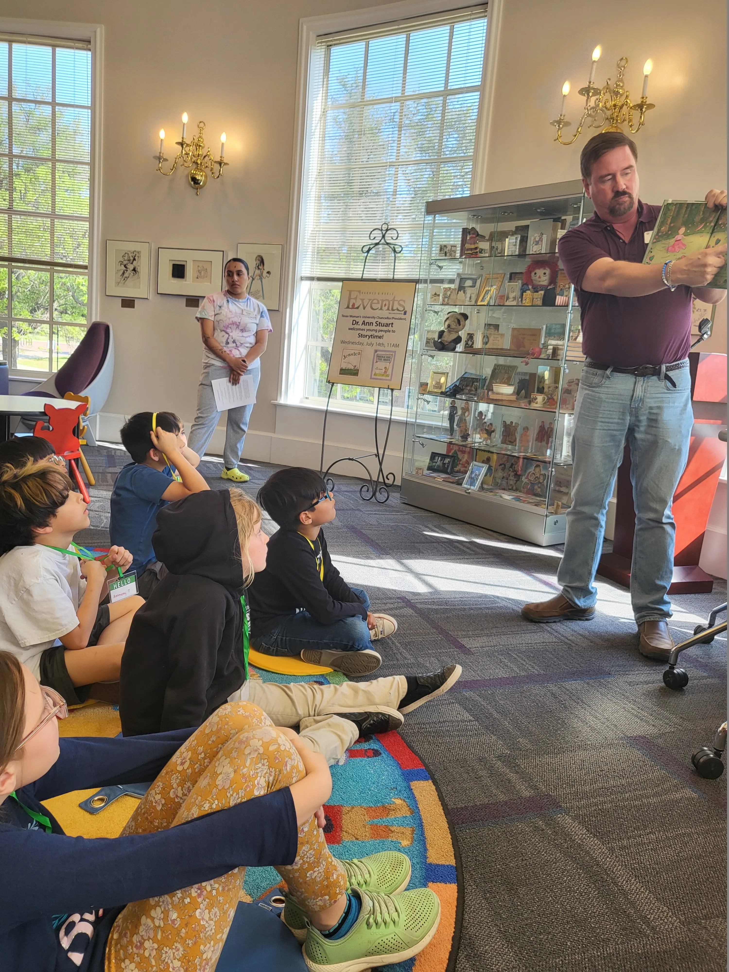 A librarian reads to a group of children