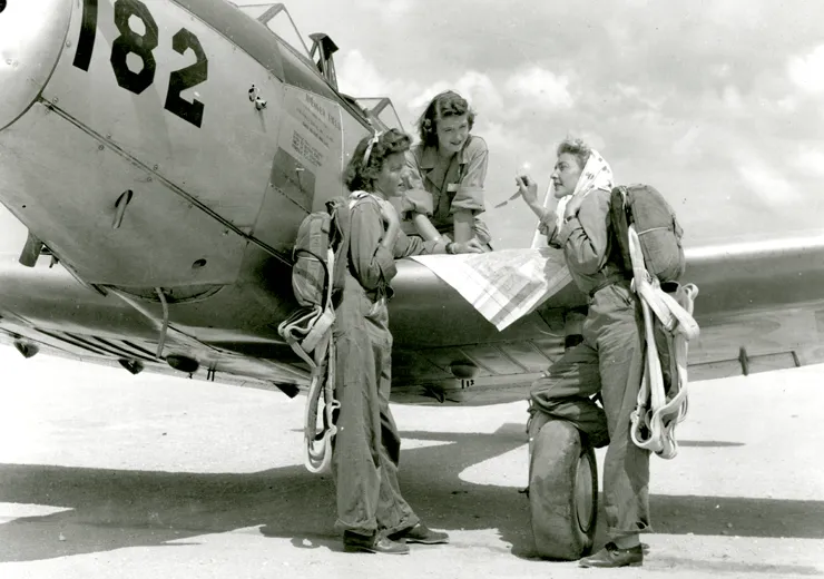 WASPs check their map prior to flight, Avenger Field, Sweetwater, Texas, August 1943.