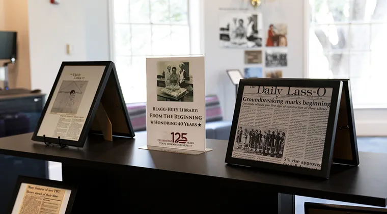 Display showing historic artifacts and a sign reading 