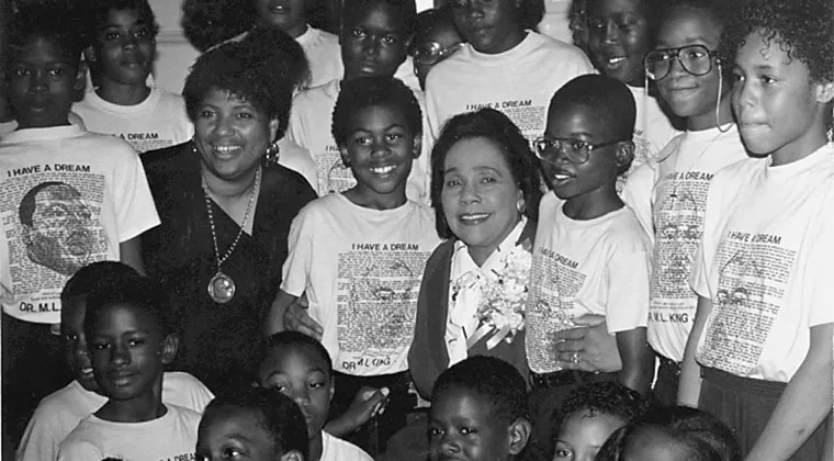 Coretta Scott King posing with a group of children