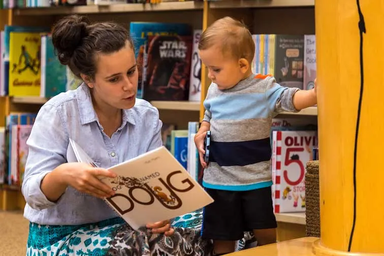 Student works with toddler