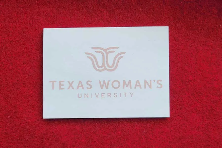 A notepad with a TWU logo on the side.