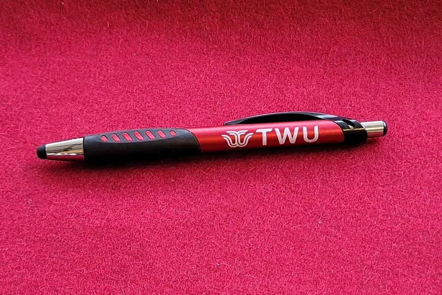 A pen with the TWU logo on the side.