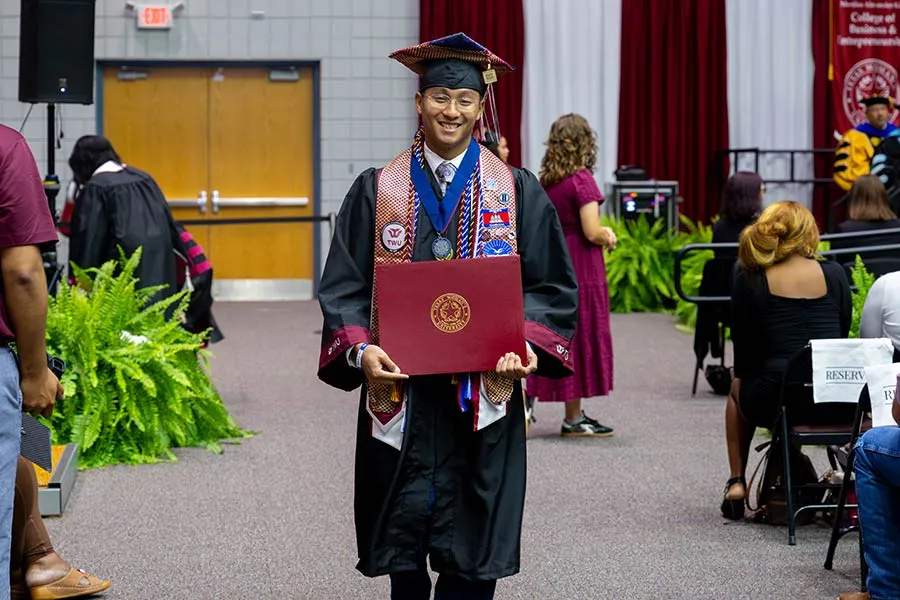A McNair Scholar graduating with honors