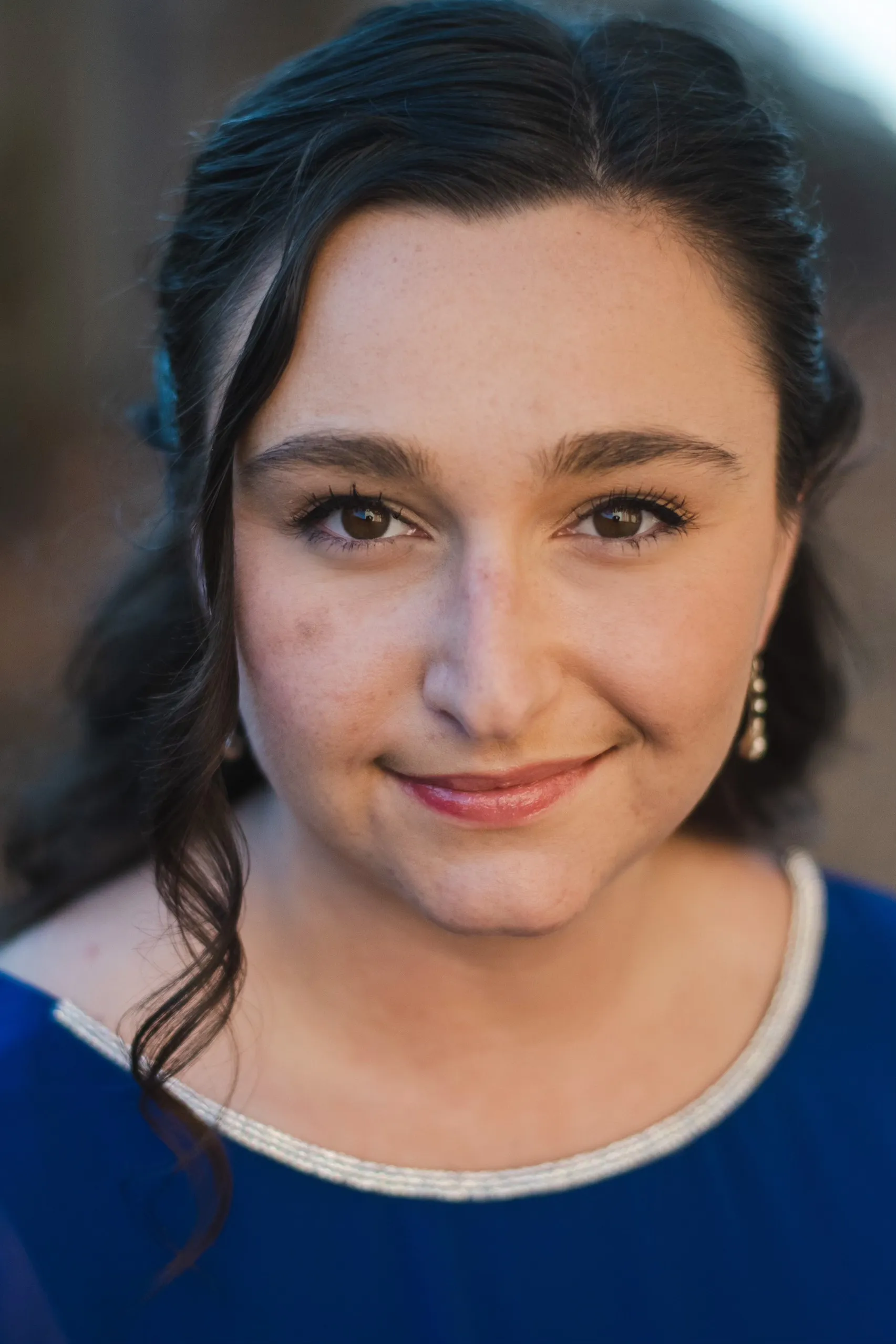 Closeup image of Kara in a dark blue top