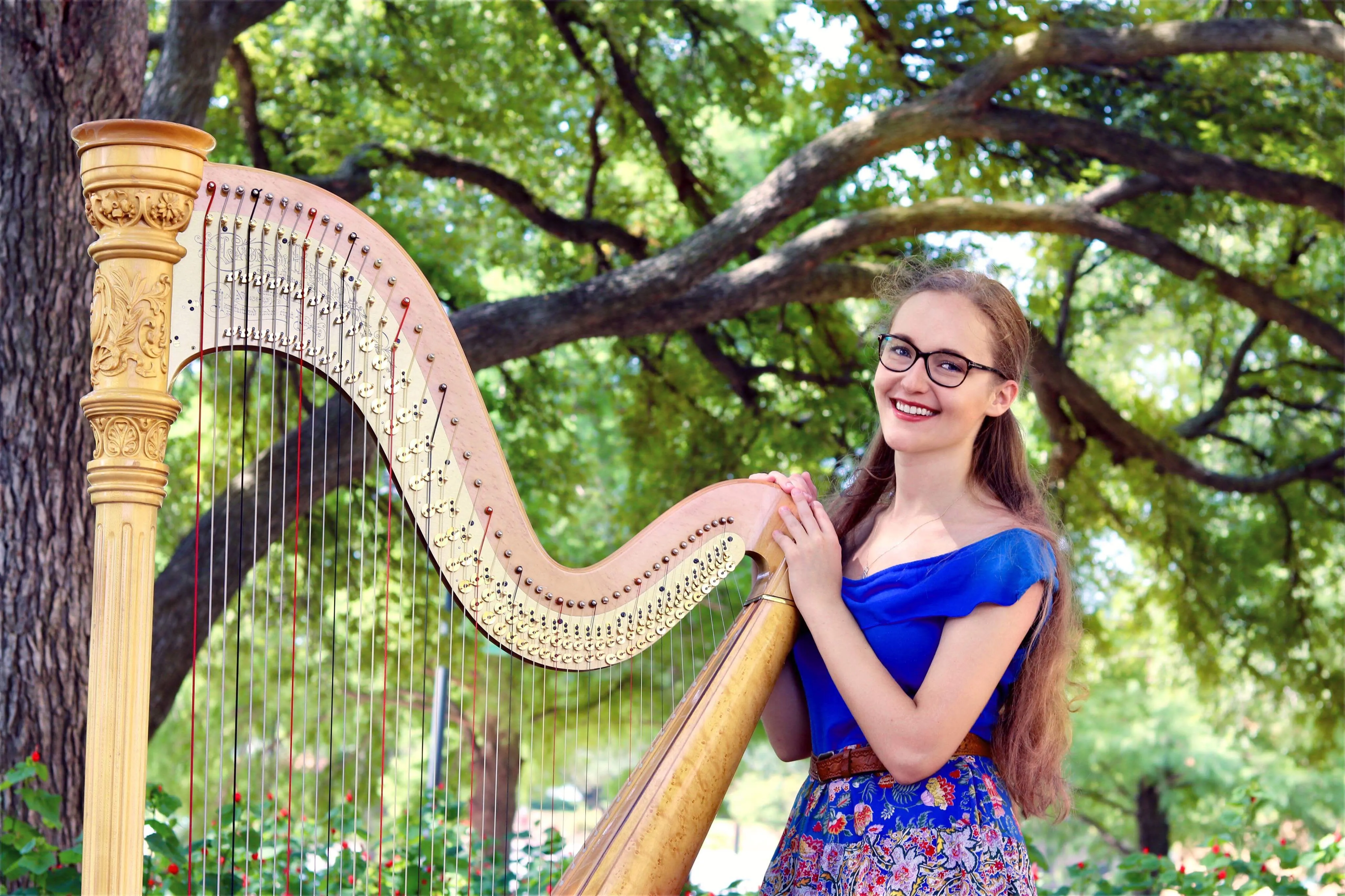 Urszula in front of a harp