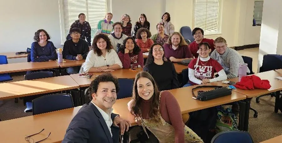 Christina Austin Lopez with Julio Augustin Matos, Jr. and a classroom of musical theatre students
