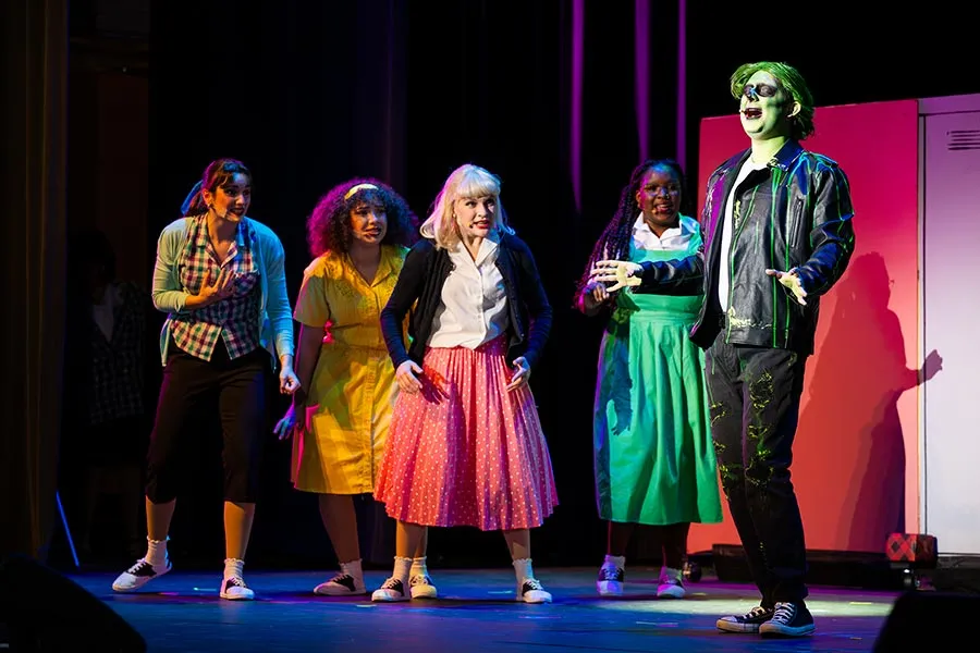 A cast of TWU musical theatre students performs Zombie Prom on stage