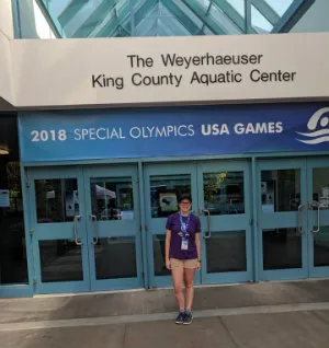Girl posing outside Weyerhaeuser King County Aquatic Center