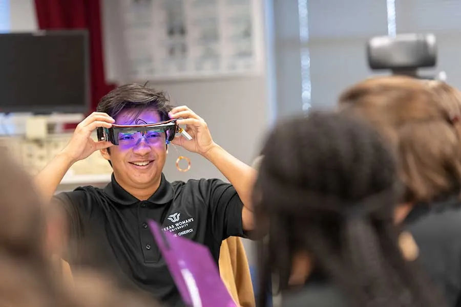 TWU student wears an electronic eyeglasses device.