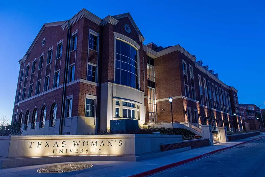 Scientific Research Commons on TWU's Denton campus at dusk.