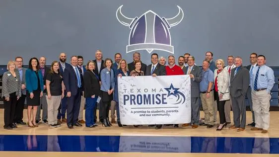 University and college administrators pose to celebrate the signing of Texoma Promise. 