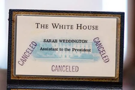 A close-up of Sarah Weddington's badge when she was Assistant to the President of the United States